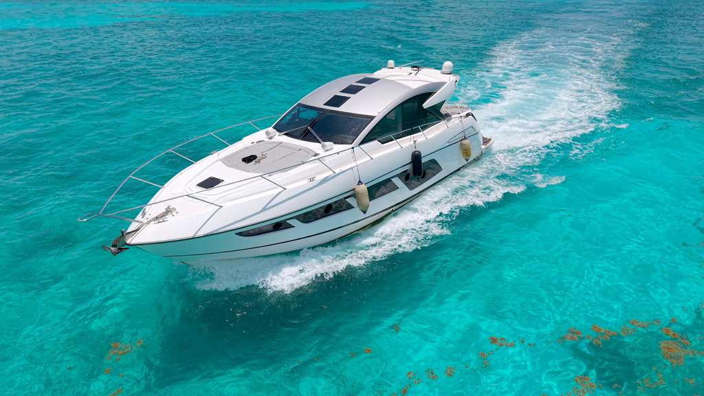 60FT Sunseeker yacht rental in Miami cruising on the water with luxury design and ocean views