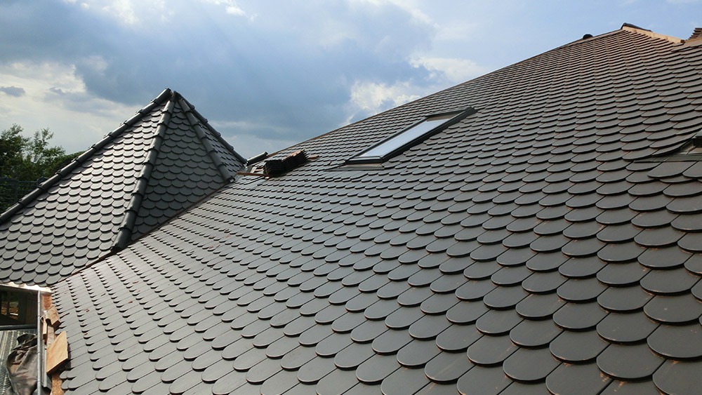 a roof with a roof top and a skylight