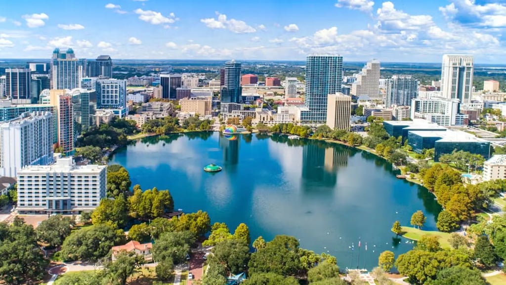 a city skyline view of a lake and a city