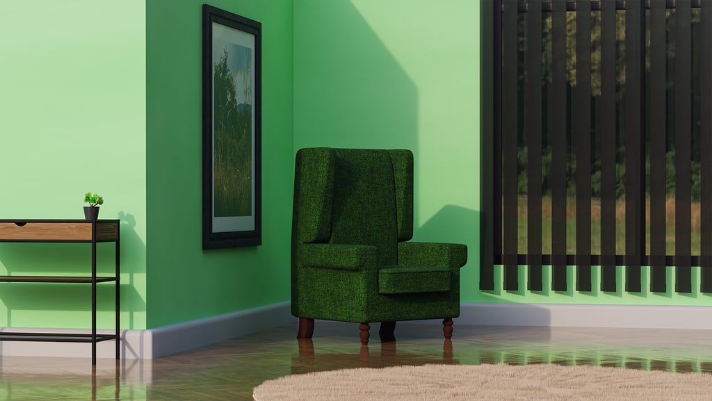 a green chair in a green room with a plant in the corner and table
