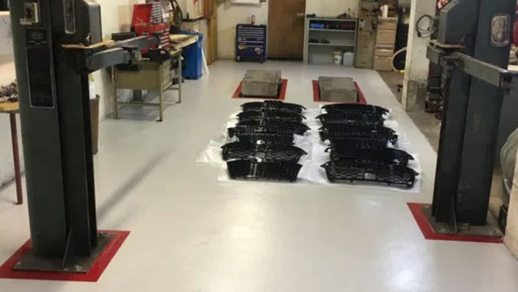 Microcement for an epoxy floor inside a professional body shop.