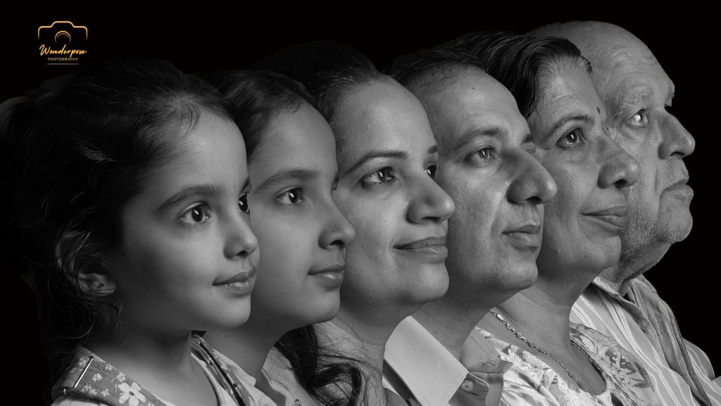 Black and white multi-generational family portrait showing three generations in profile.