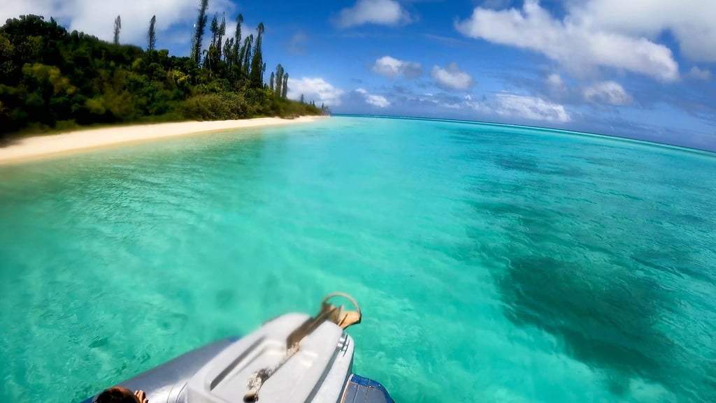 a person is sitting on a boat in the ocean