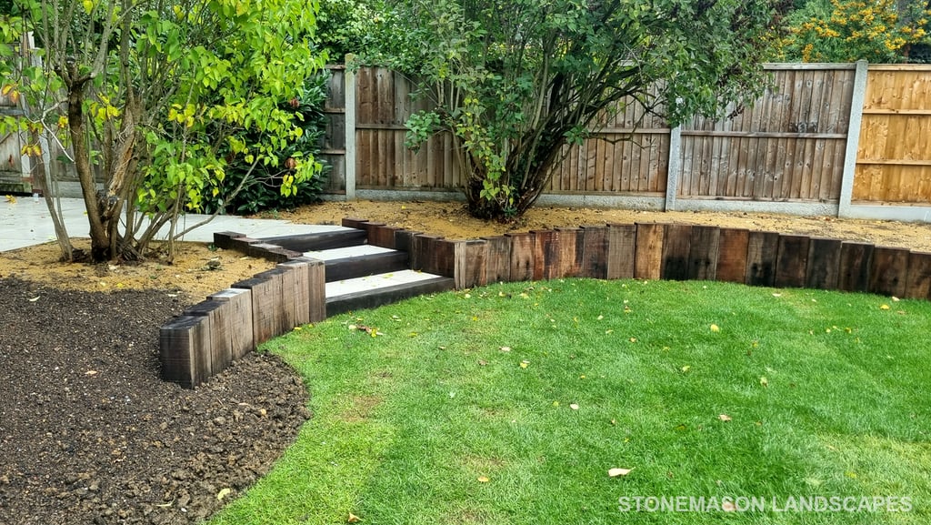 800m2 Full Garden Remodel Curved Sleeper Retaining Wall Planters, Lawn & Split-face Tiled Wall Step