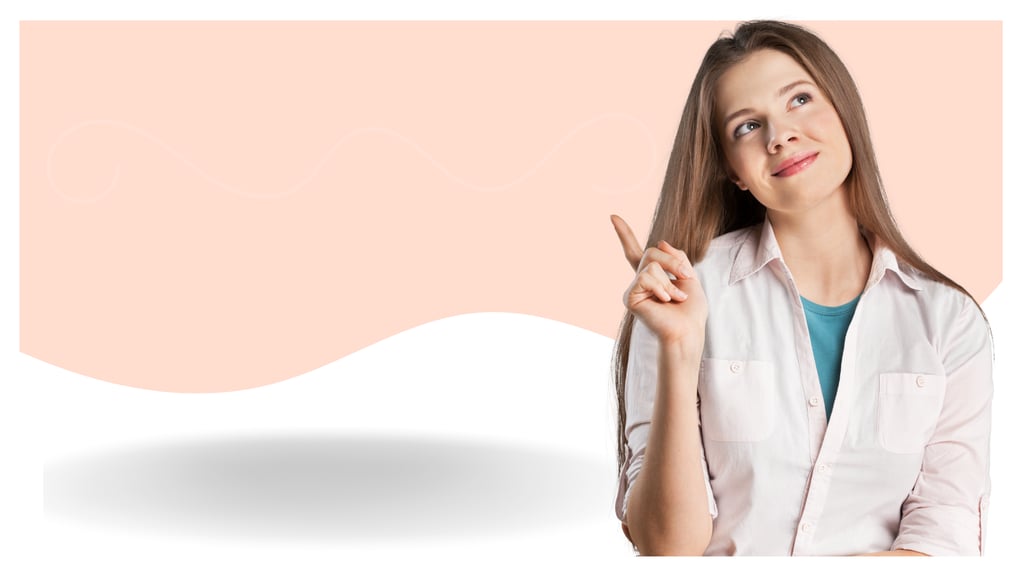 A thoughtful young woman points up toward copy space on a peach and white background.