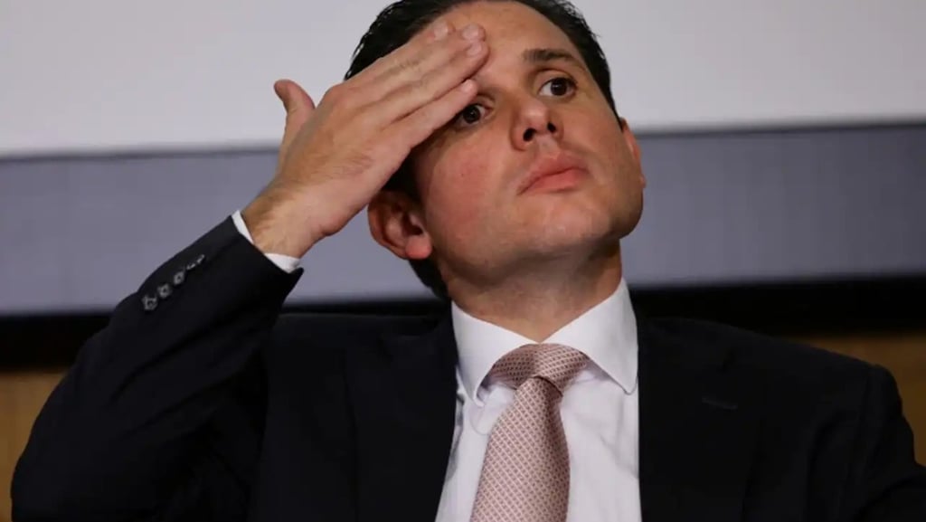 a man in a suit and tie is looking up at the sky