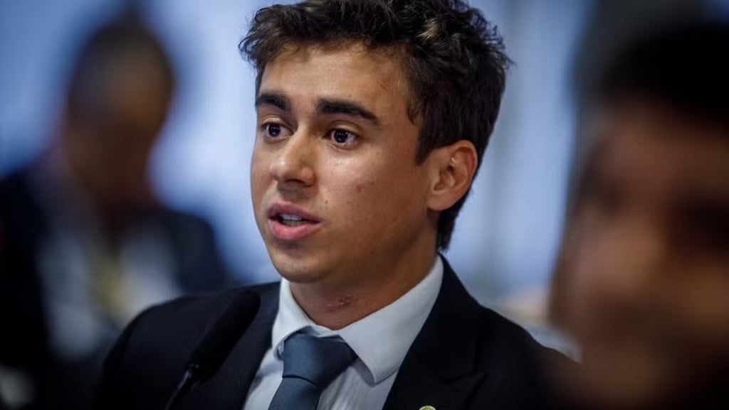 a man in a suit and tie with a microphone