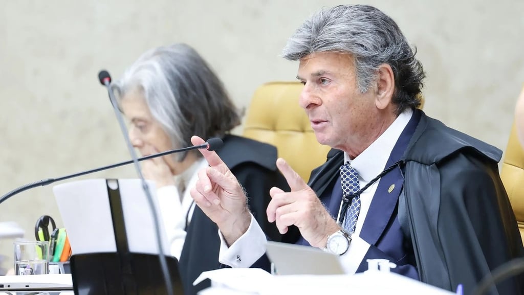 a man in a suit and tie is sitting at a table