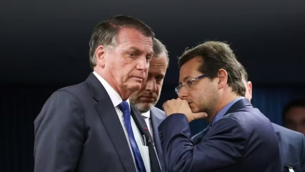 two men in suits and ties standing next to each other