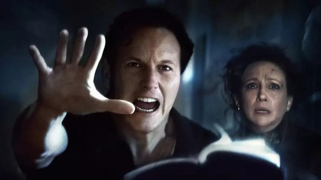 a man and woman in a dark room