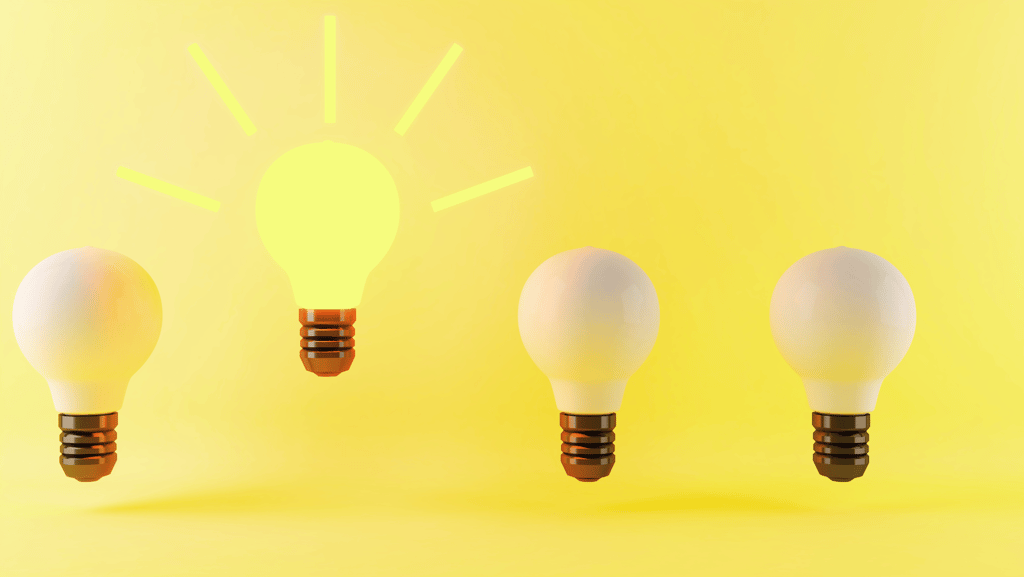a group of three light bulbs with a light bulb on top displaying consistency 