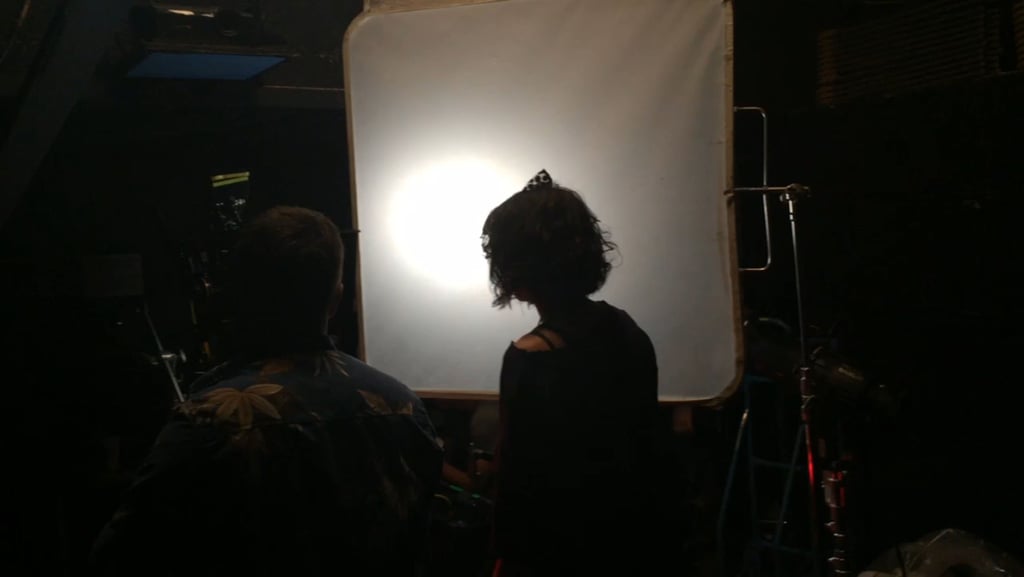 Actress Starlise Waschuk silhouetted on the set of Fatal Rhapsody