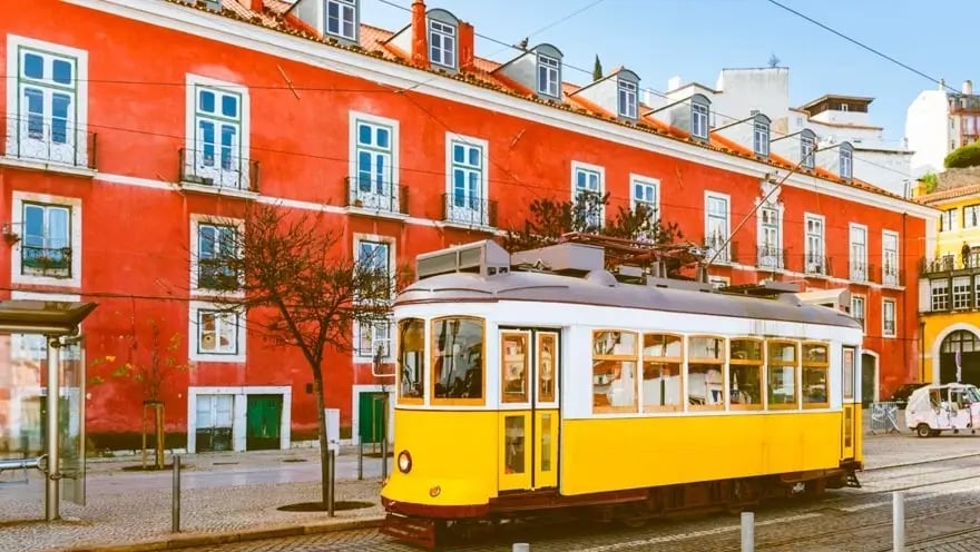 a trolley car on a city street in the city