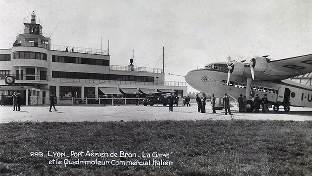Bron Airport at Lyon, France, building and an Italian four engine propellor passenger plane