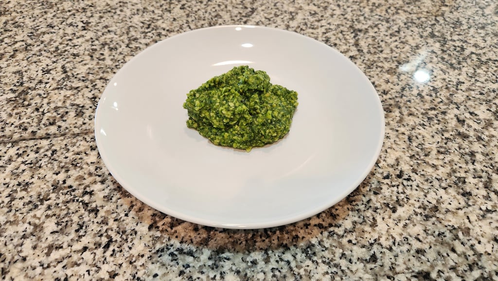 a plate on a counter with pesto