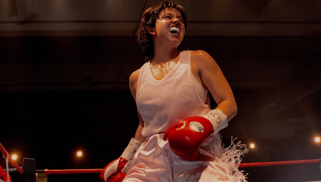 Christy Martin in a white dress and red boxing gloves