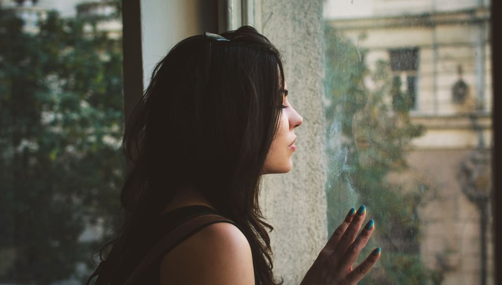 woman feeling anxious and overwhelmed at home