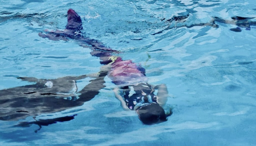 Mermaid learning to swim