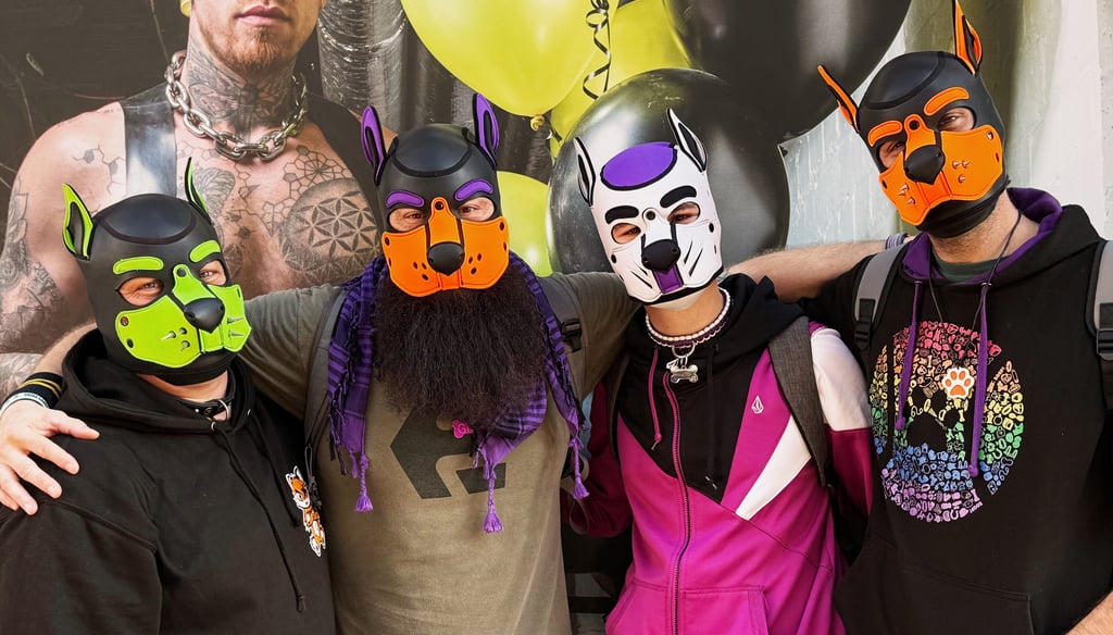 Four friends posing in pup masks.