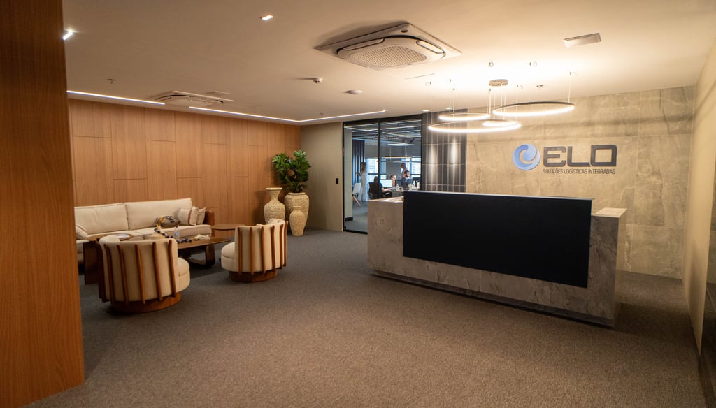 a reception area with a reception table and chairs