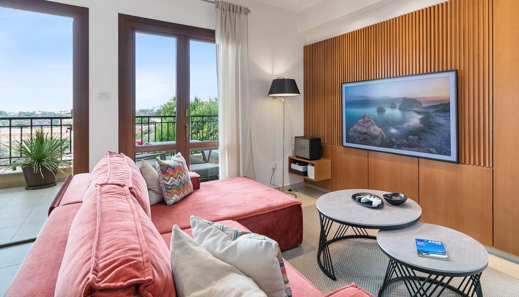 Sofa seating area with large TV and entertainment options at Theseus Retreat holiday rental in Cyprus