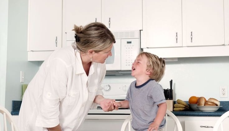 Mother comforts her son
