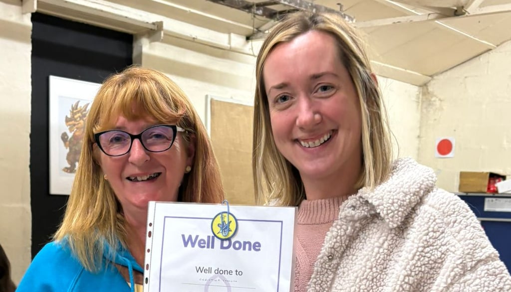 A certificate has been awarded by a beavers leader to Christine for painting the 25th Allerton Scout Hut 