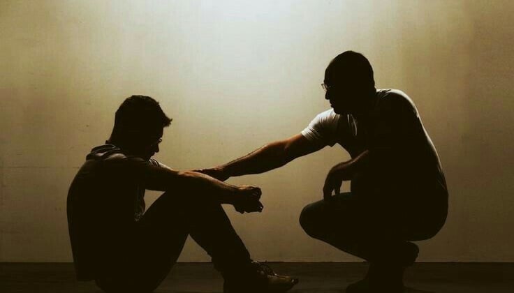 man talks with another