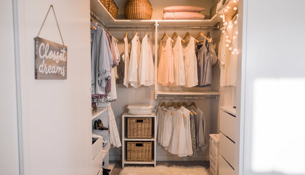 Organized walk-in closet with hanging white shirts, wicker baskets, and a plush rug.