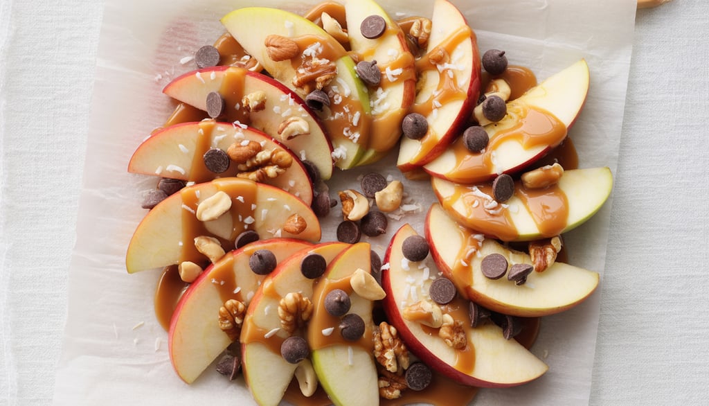 a plate of apples and nuts on a table