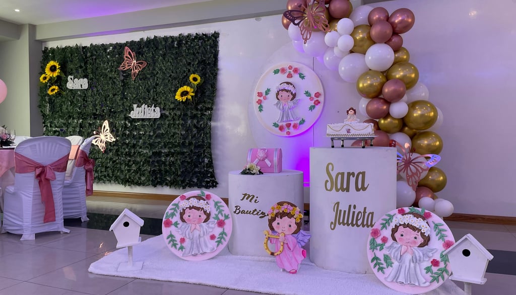 a table with a bunch of balloons and balloons