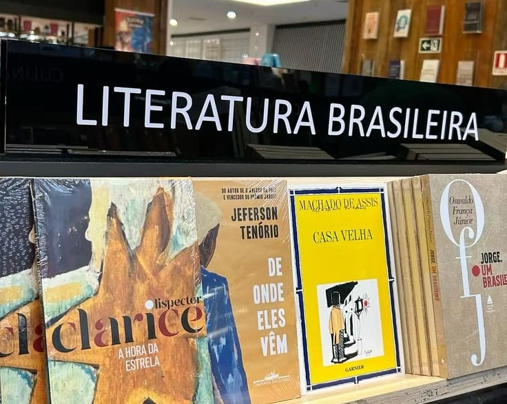 a book shelf with books and a sign that says,'it's a