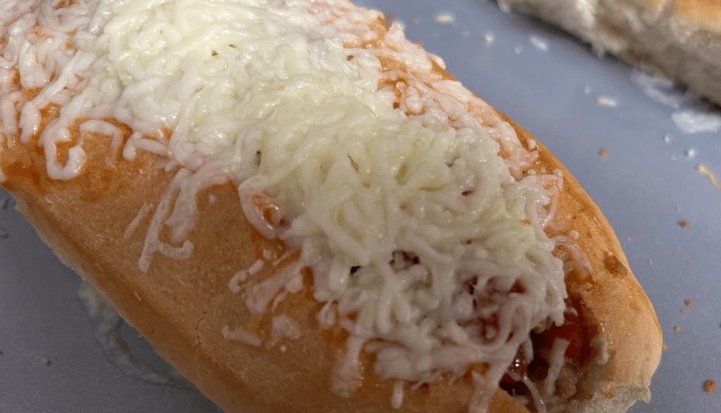 Turkey Meatball sub with melted cheese on top.