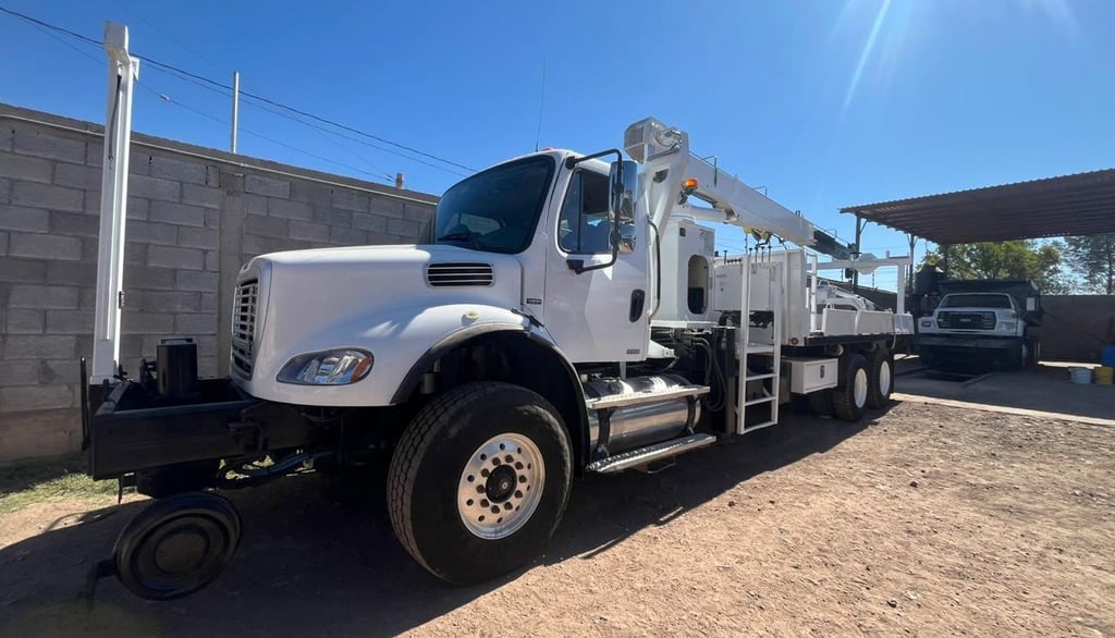 a white truck with a crane on it