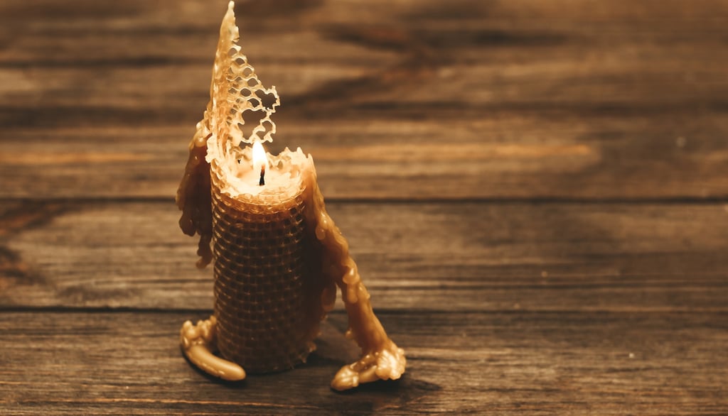 Eco-friendly beeswax candle burning naturally on a wooden table, sustainable alternative to paraffin