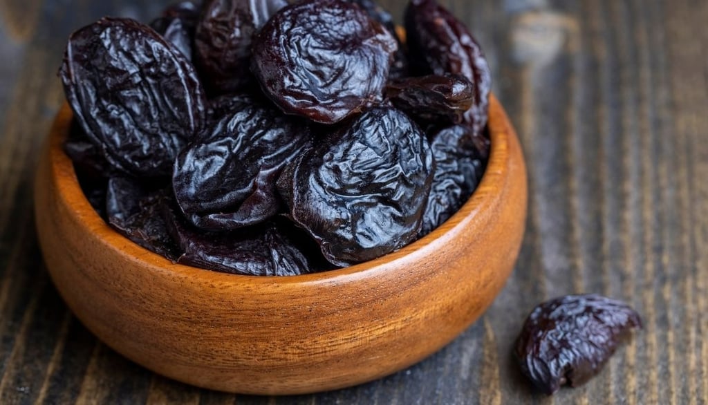 Dried plums in a bowl