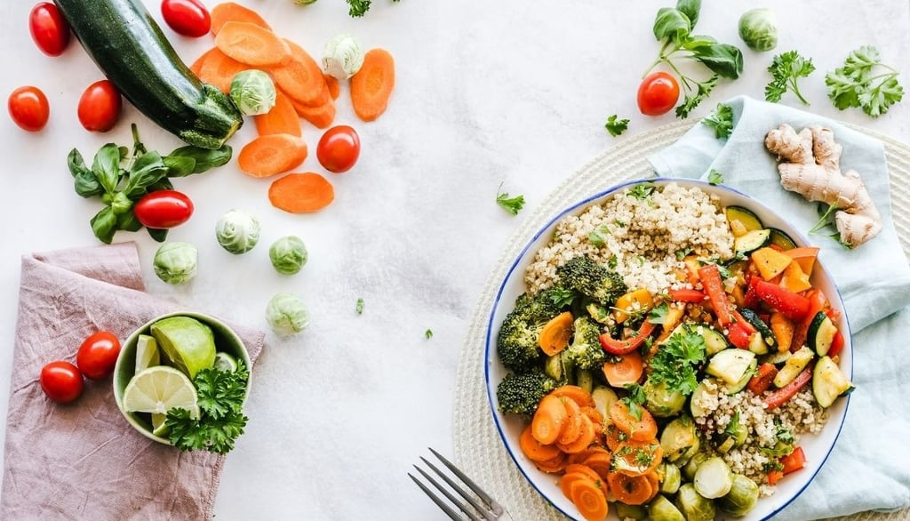a plate of vegetables and vegetables on a table