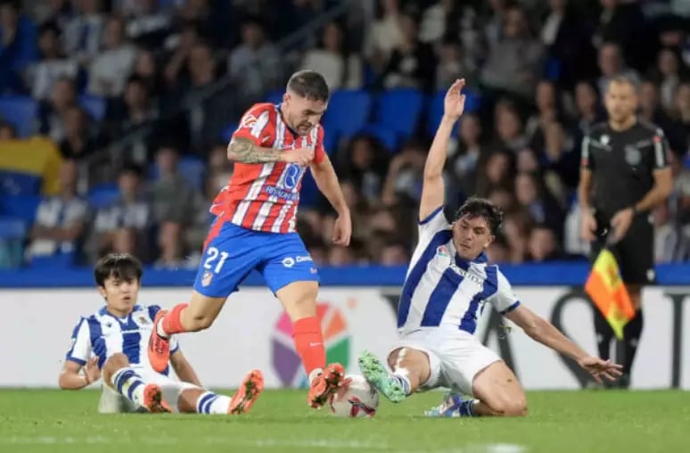 a soccer player is kicking a soccer ball
