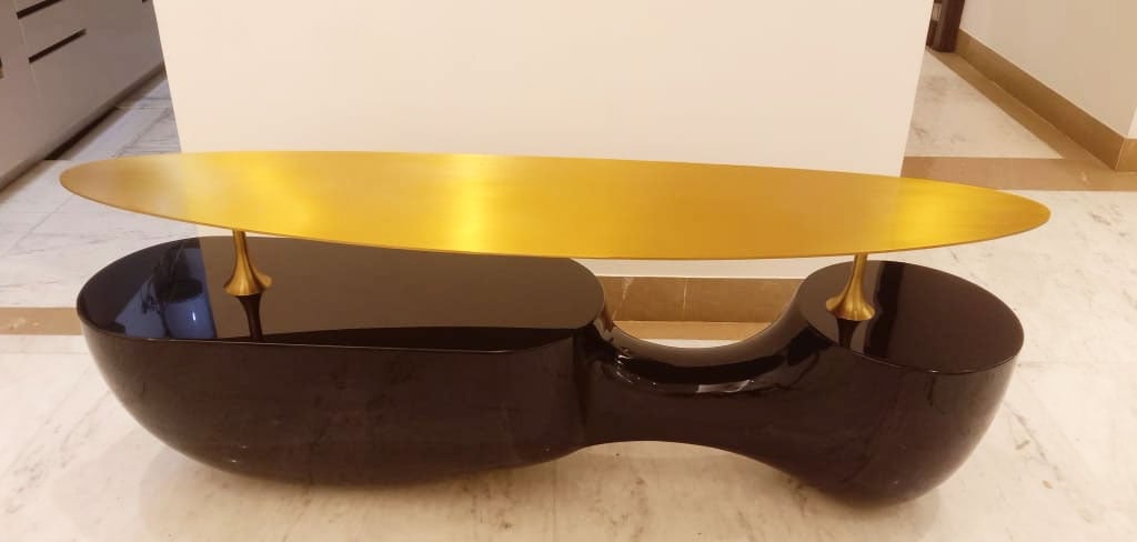 a table with a gold leaf on it