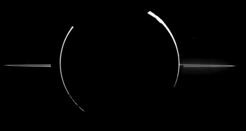 a black and white photo of a ring around the moon
