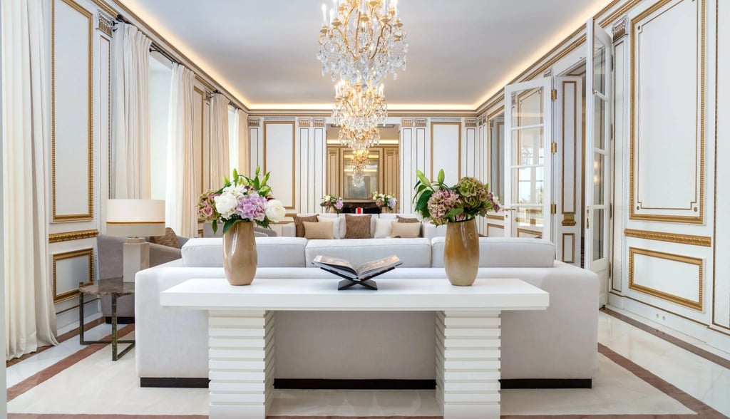 Ornate reception room with gold detailing and chandelier