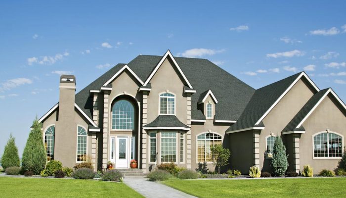 a large house with a nice lawn and a nice house