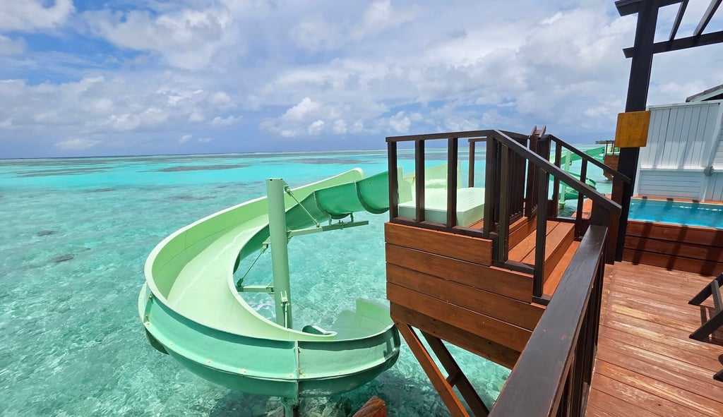Ozen Life Madhoo Maldives overwatrer villa slide