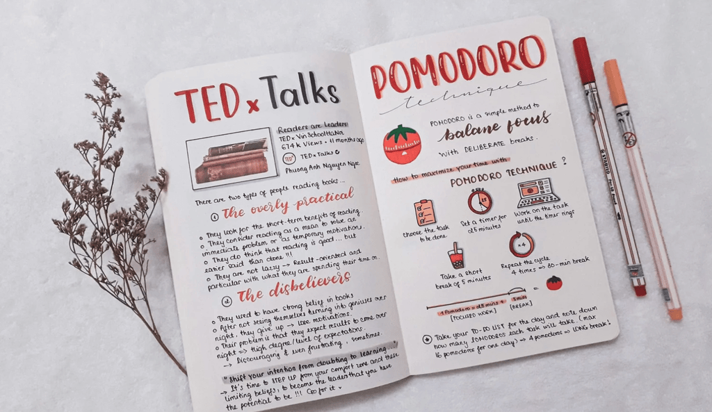 a notebook with a notebook and pens on it