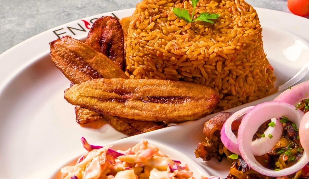 Jollof rice with plantain and salad