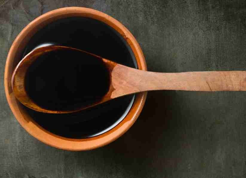 orietal style sauce ina wooden bowl