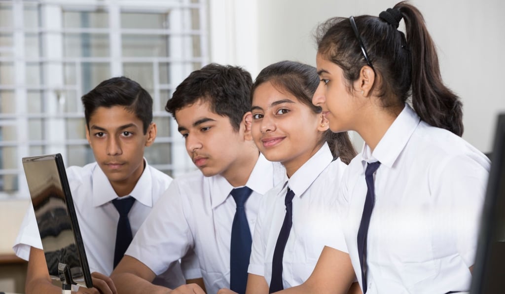 Computer Training, students learning in a digital classroom at Smart Village Computer. 