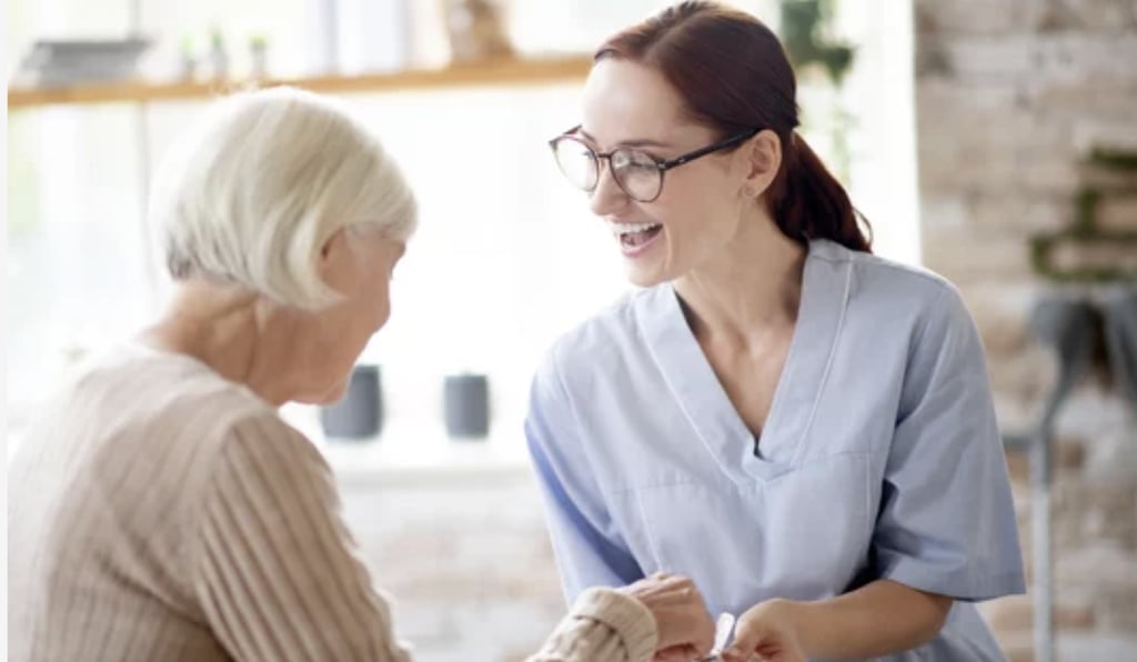 Nurse supporting elderly. 