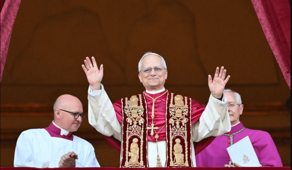 a priest with his hands up and his hands up