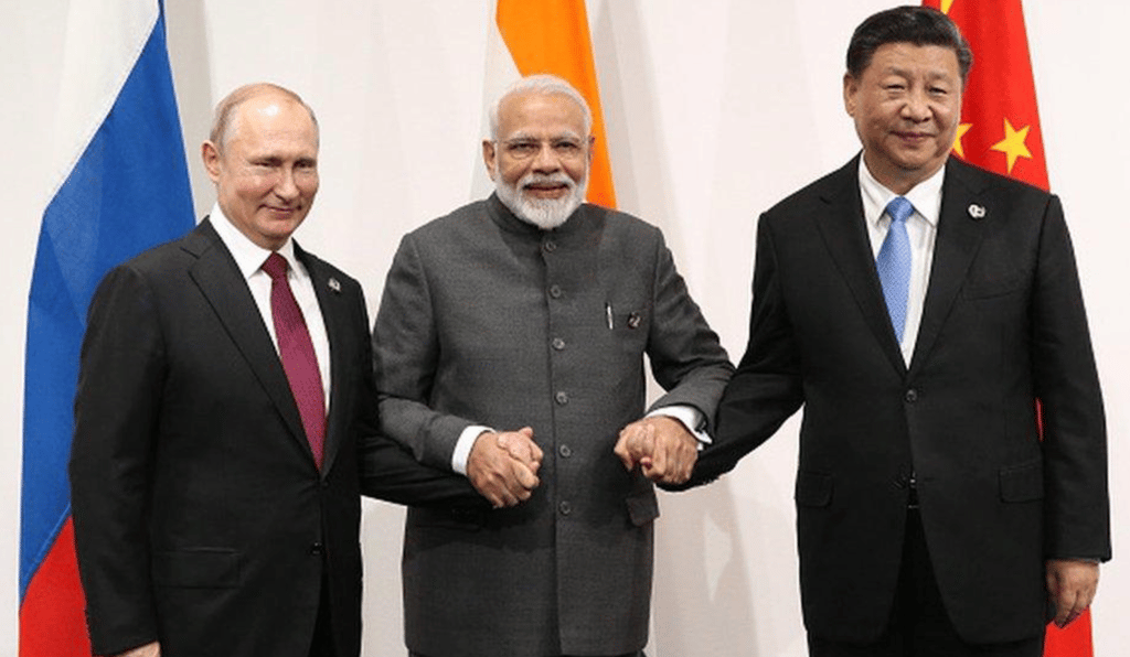 a group of three men standing next to each other